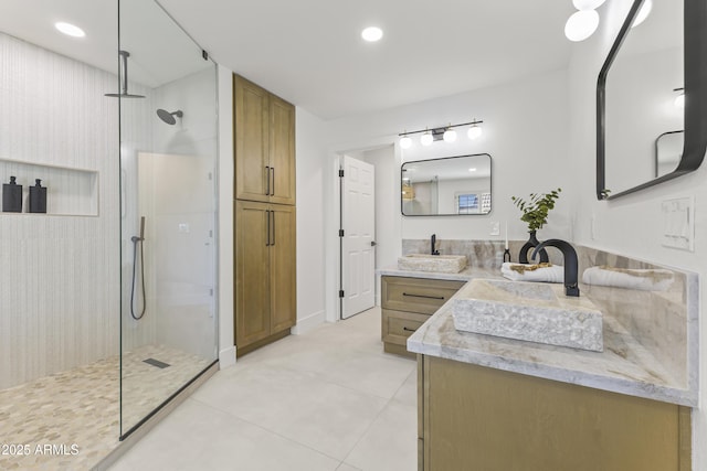 bathroom featuring tile patterned floors, vanity, recessed lighting, and a walk in shower