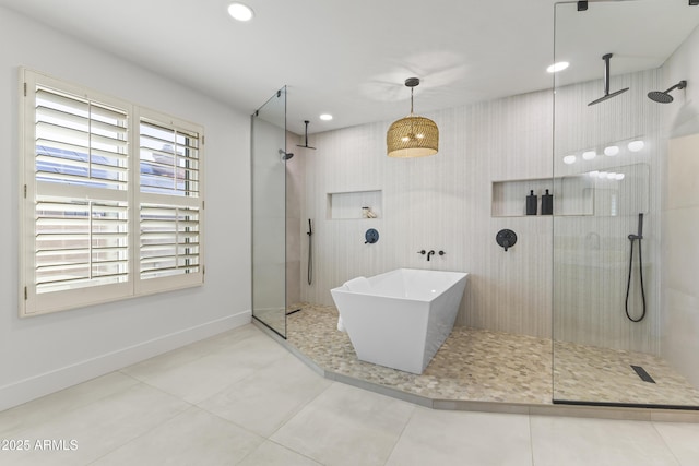 full bath with a walk in shower, recessed lighting, baseboards, a soaking tub, and tile patterned floors