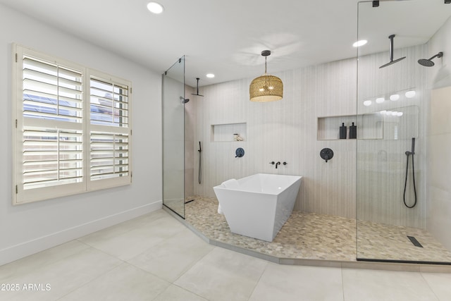 bathroom featuring recessed lighting, walk in shower, tile patterned flooring, and baseboards