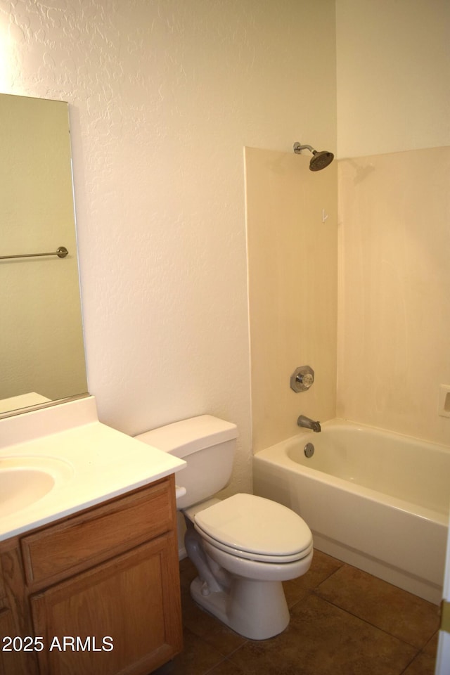 bathroom with toilet, tile patterned flooring, shower / washtub combination, and vanity