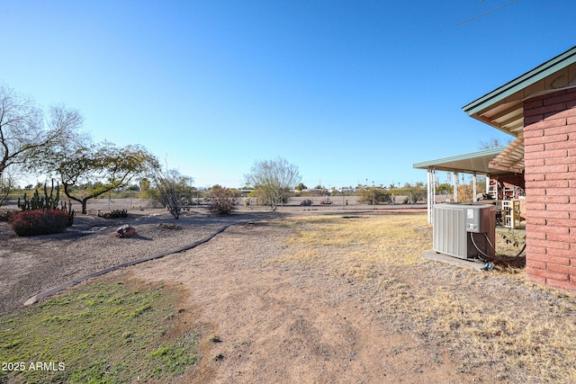 view of yard featuring a rural view and cooling unit