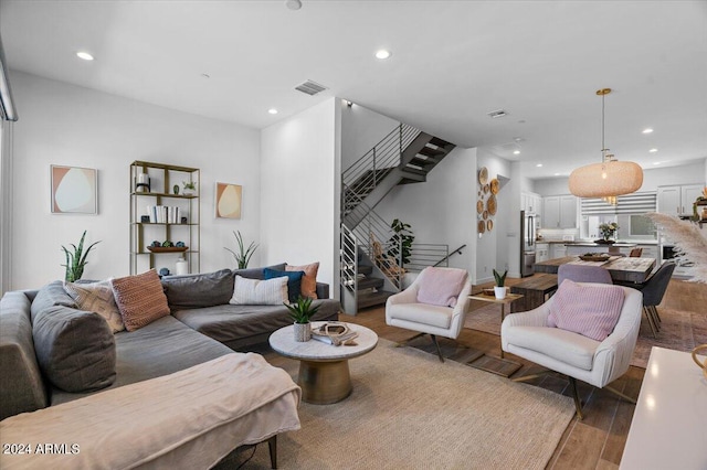 living room with dark hardwood / wood-style flooring