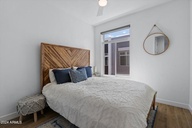 bedroom featuring wood-type flooring and ceiling fan