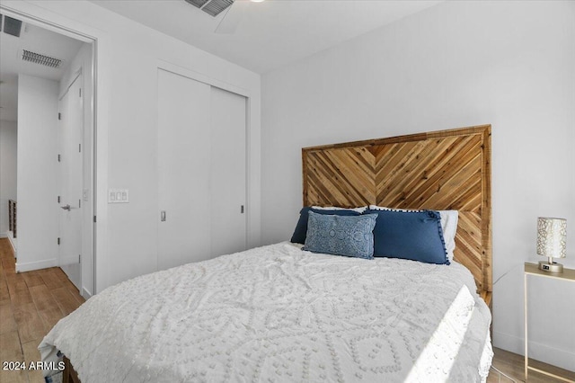 bedroom featuring a closet and hardwood / wood-style floors