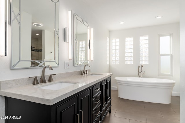 bathroom featuring a bathing tub and vanity