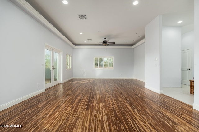 spare room featuring french doors, ceiling fan, and hardwood / wood-style floors