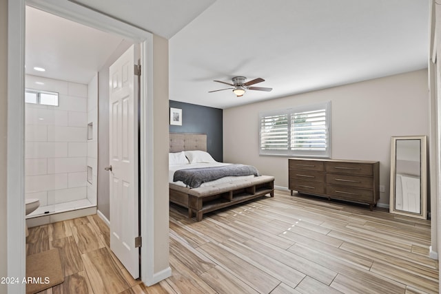 bedroom featuring ceiling fan and ensuite bathroom