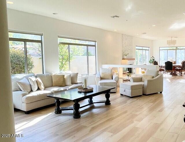 8227 E Beardsley Rd, Scottsdale, AZ 85255 - living room featuring recessed lighting, light wood-style flooring, and visible vents