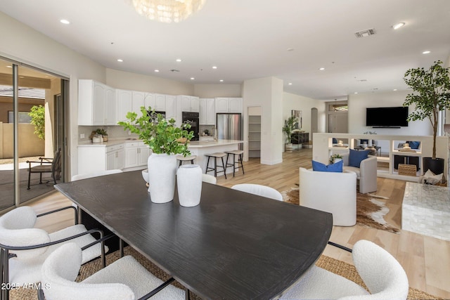 8227 E Beardsley Rd, Scottsdale, AZ 85255 - dining space featuring visible vents, recessed lighting, and light wood-style floors