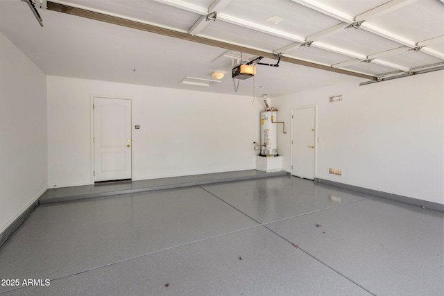 8227 E Beardsley Rd, Scottsdale, AZ 85255 - garage with baseboards, a garage door opener, and gas water heater