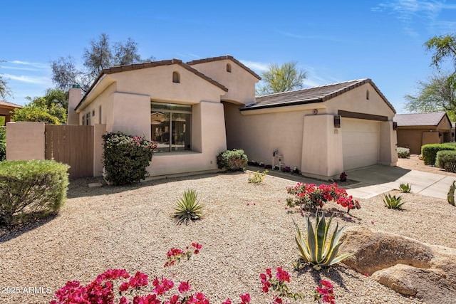 8227 E Beardsley Rd, Scottsdale, AZ 85255 - mediterranean / spanish-style house featuring an attached garage, concrete driveway, stucco siding, and a tile roof