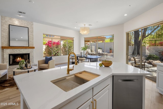 8227 E Beardsley Rd, Scottsdale, AZ 85255 - kitchen with a sink, open floor plan, plenty of natural light, and visible vents