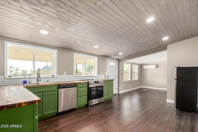 kitchen featuring butcher block counters, appliances with stainless steel finishes, wooden ceiling, green cabinetry, and a wall unit AC