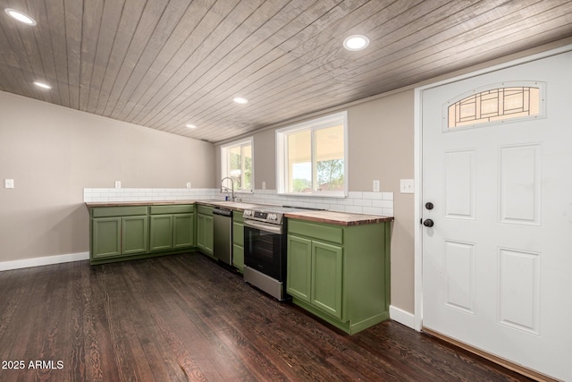 kitchen with wood ceiling, green cabinets, butcher block counters, appliances with stainless steel finishes, and dark wood-type flooring