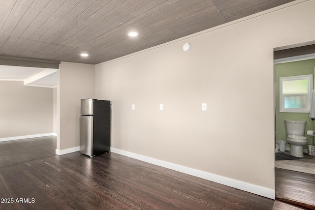 interior space featuring recessed lighting, dark wood-style floors, wooden ceiling, freestanding refrigerator, and baseboards