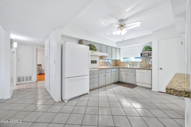 kitchen with ceiling fan, sink, white appliances, decorative backsplash, and light tile patterned flooring