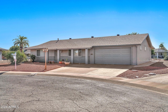 ranch-style home featuring a garage