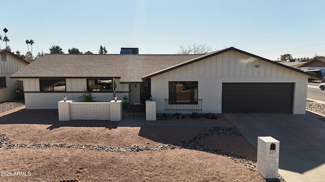 ranch-style home with a garage and central AC unit