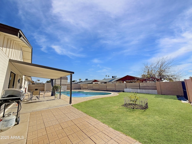 view of yard with a fenced in pool and a patio area