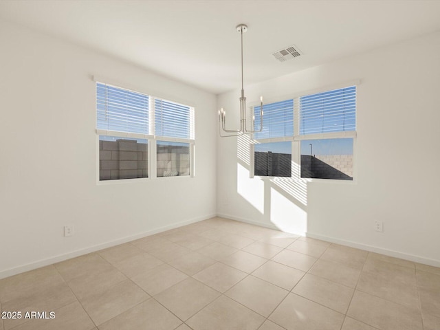 unfurnished dining area featuring light tile patterned floors