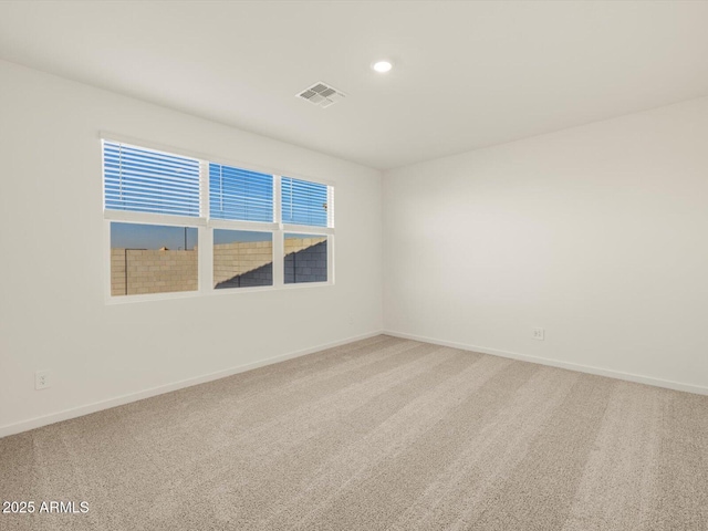 empty room with carpet flooring