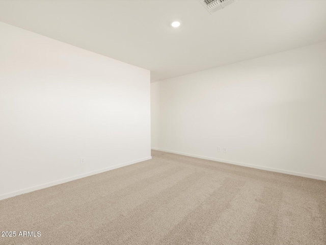 empty room featuring light colored carpet