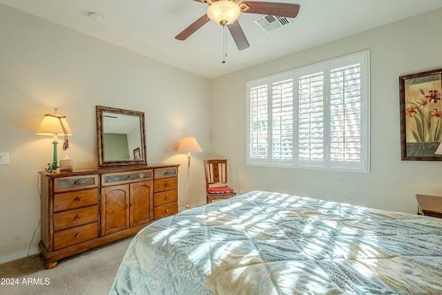 bedroom with light colored carpet and ceiling fan