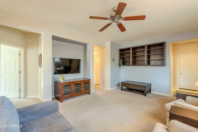 living room featuring ceiling fan and light colored carpet