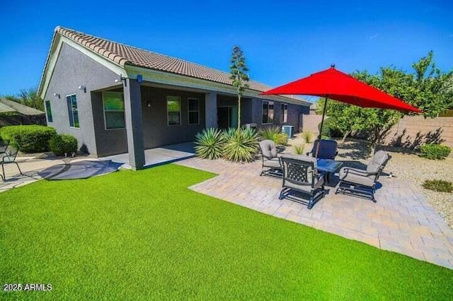 6731 S 37th Dr, Phoenix, AZ 85041 - rear view of house with a patio, a tiled roof, and stucco siding
