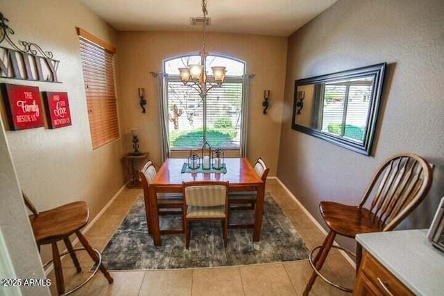 6731 S 37th Dr, Phoenix, AZ 85041 - dining room with a chandelier and tile patterned flooring