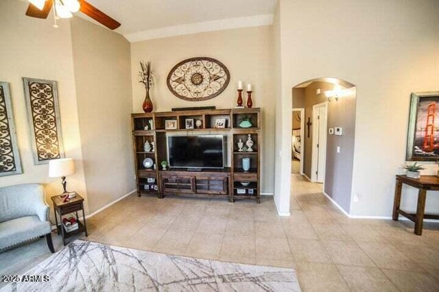 6731 S 37th Dr, Phoenix, AZ 85041 - tiled living area with arched walkways and a ceiling fan