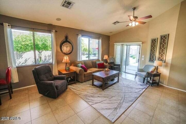 6731 S 37th Dr, Phoenix, AZ 85041 - living room featuring a ceiling fan, light tile patterned floors, and lofted ceiling