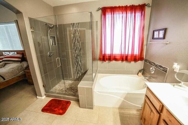 6731 S 37th Dr, Phoenix, AZ 85041 - ensuite bathroom featuring a garden tub, a stall shower, tile patterned flooring, and vanity