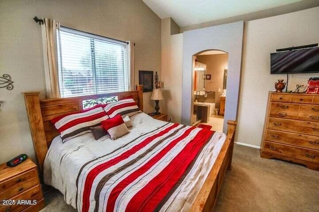 6731 S 37th Dr, Phoenix, AZ 85041 - bedroom featuring arched walkways, carpet, lofted ceiling, and connected bathroom