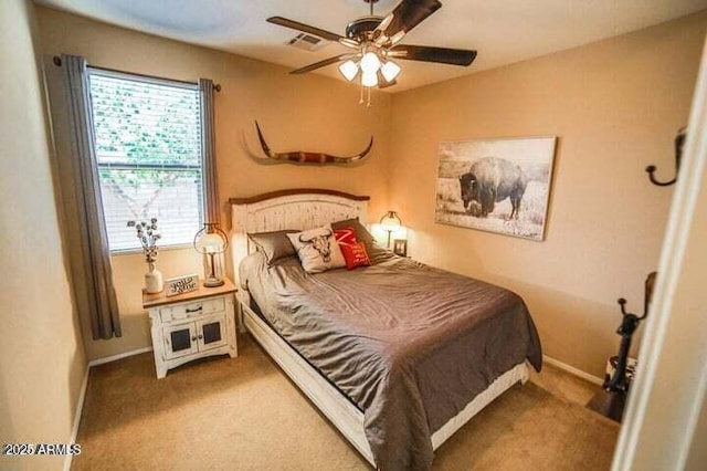 6731 S 37th Dr, Phoenix, AZ 85041 - carpeted bedroom with baseboards and a ceiling fan