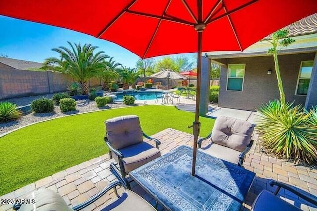 6731 S 37th Dr, Phoenix, AZ 85041 - fenced backyard with a patio area