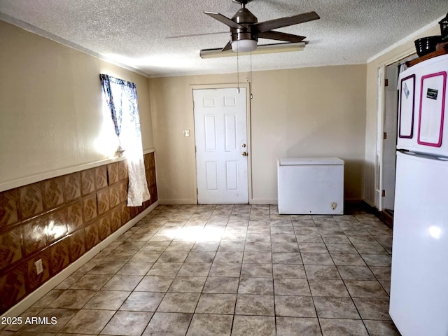 111 W 9th St, Ajo, AZ 85321 - spare room featuring a textured ceiling and ceiling fan