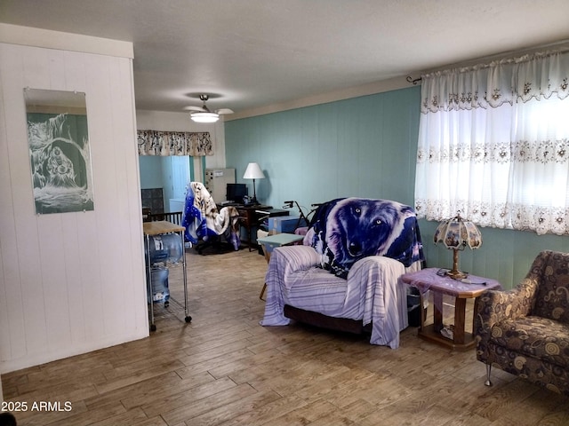 111 W 9th St, Ajo, AZ 85321 - living area featuring wood finished floors, ceiling fan, and wooden walls
