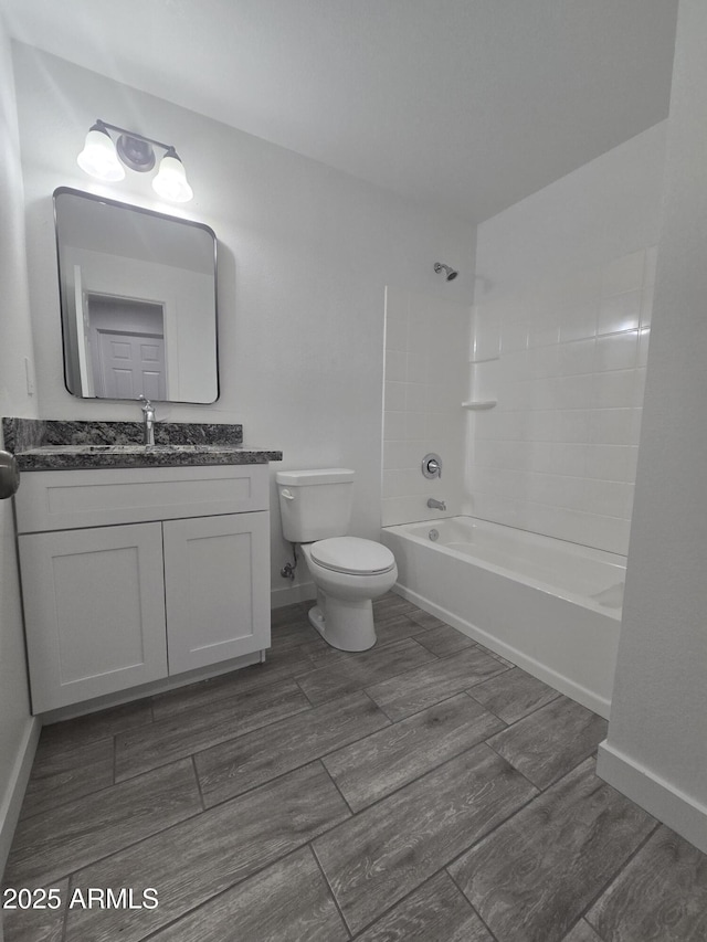 full bathroom featuring shower / bathing tub combination, vanity, and toilet