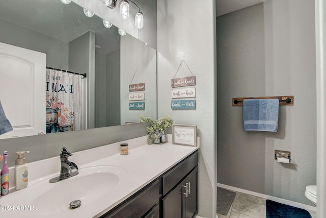 full bathroom with baseboards, toilet, a shower with curtain, tile patterned floors, and vanity