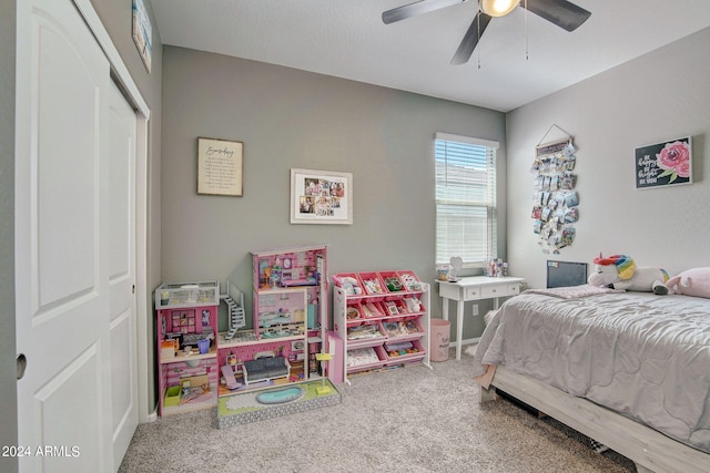 bedroom featuring a closet, ceiling fan, and carpet flooring