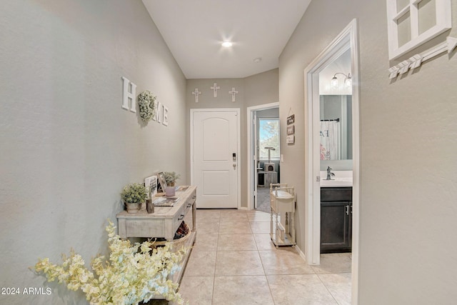 interior space with sink and light tile patterned floors