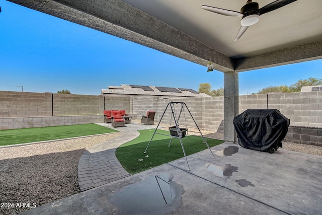 view of patio with a fenced backyard, grilling area, and ceiling fan