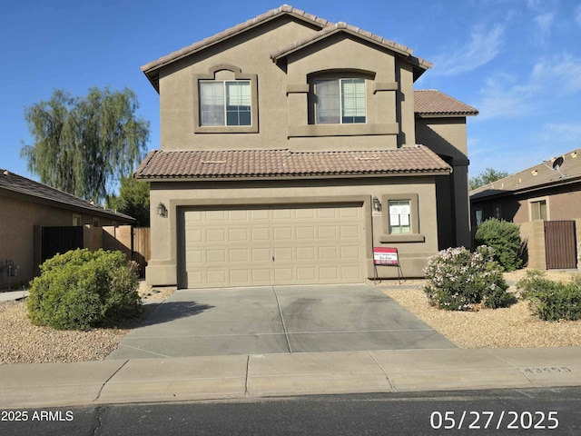 43455 W Chisholm Dr, Maricopa, AZ 85138 - mediterranean / spanish house with driveway, stucco siding, a garage, and a tiled roof
