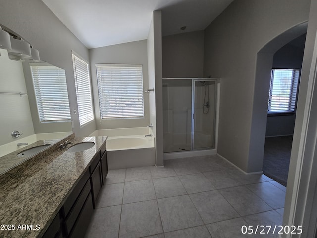 43455 W Chisholm Dr, Maricopa, AZ 85138 - full bathroom featuring a garden tub, vanity, a stall shower, tile patterned floors, and lofted ceiling