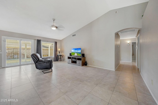 living room featuring high vaulted ceiling, light tile patterned floors, and ceiling fan