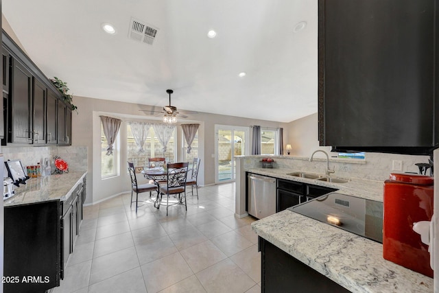 kitchen with dishwasher, light stone countertops, sink, and a healthy amount of sunlight