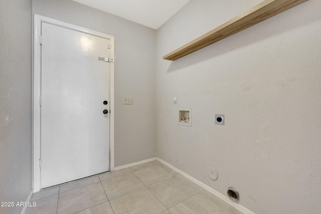 laundry area featuring gas dryer hookup, washer hookup, light tile patterned floors, and hookup for an electric dryer