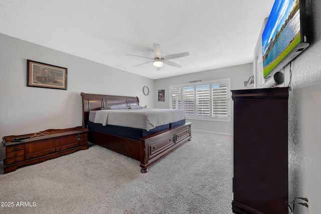 bedroom featuring ceiling fan and light colored carpet