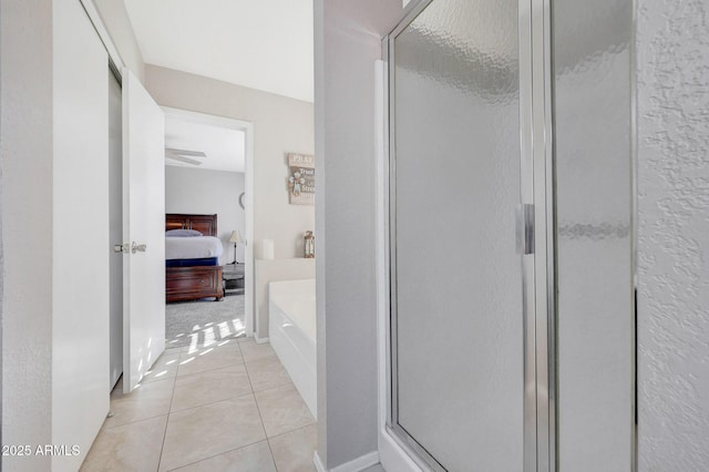 bathroom featuring separate shower and tub and tile patterned floors